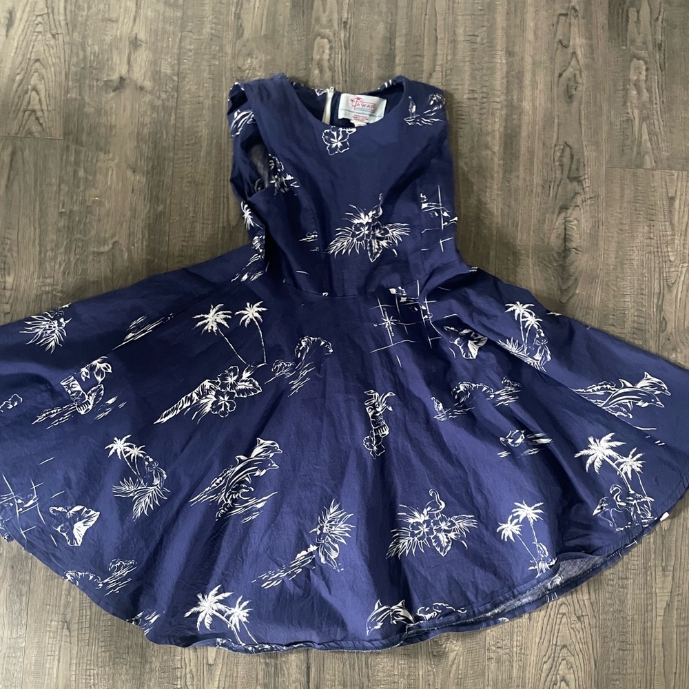 Classic cotton blue dress with decals of palm trees in great condition.